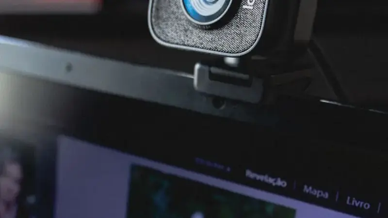Close-up of a webcam mounted on a monitor for video chat