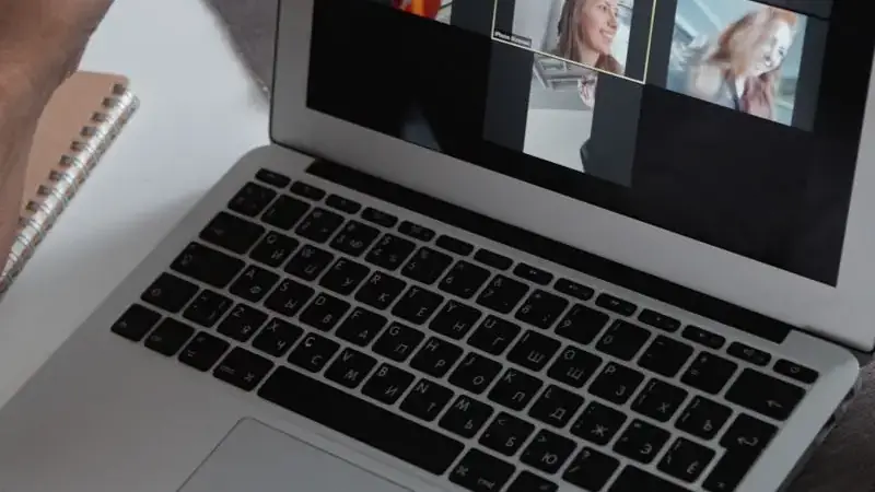 Laptop showing a video call grid while troubleshooting Umingle